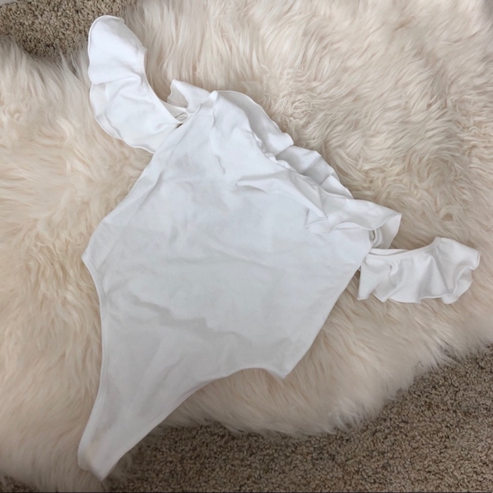 white ruffled bodysuit